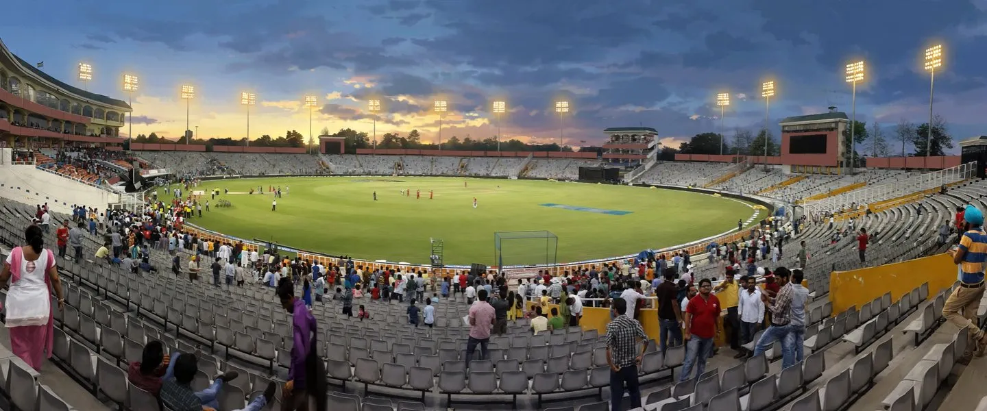 The PCA IS Bindra cricket stadium in Mohali under floodlights at dusk