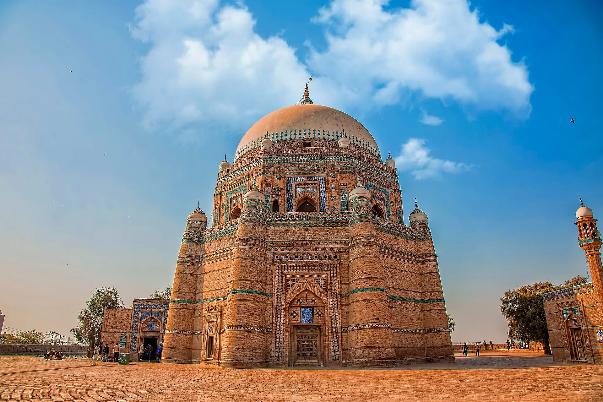 The blue tiled tomb of Shah Rukn-e-Alam at Multan under a wide sky